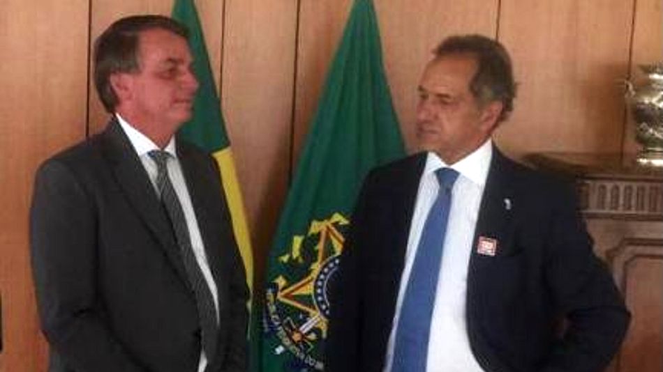 El presidente de Brasil Jair Bolsonaro junto a Daniel Scioli.