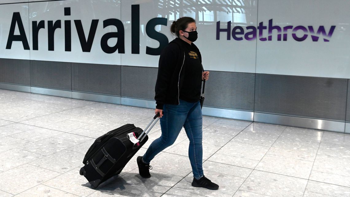 A passenger walks through Heathrow terminal in London, England.