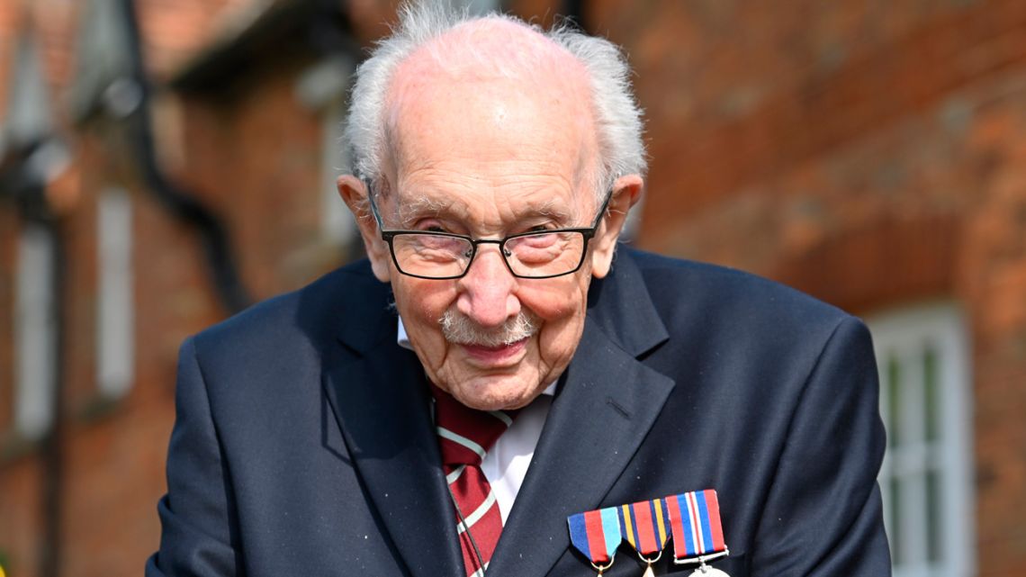 In this file photo taken on April 16, 2020, British World War II veteran Captain Tom Moore poses doing a lap of his garden in the village of Marston Moretaine, 50 miles north of London, on April 16, 2020. 