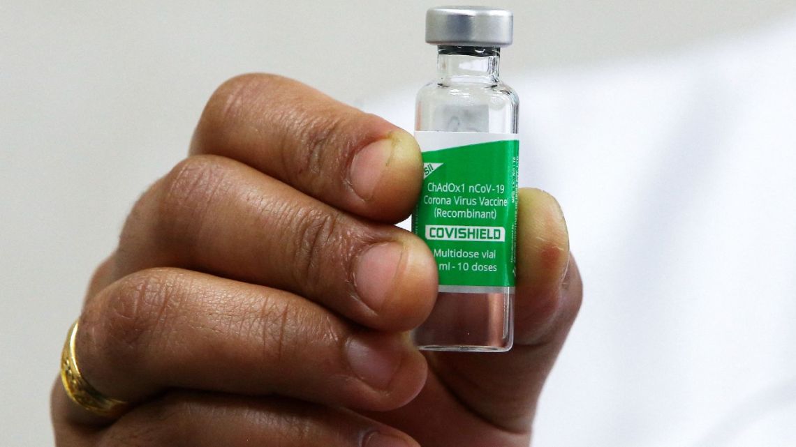 A nurse affiliated with the Kuwaiti Ministry of Health holds a dose of the Oxford-AstraZeneca Covid-19 vaccine (Covishield) in her hand at al-Masayel new vaccination centre in Kuwait City, on February 7, 2021. 