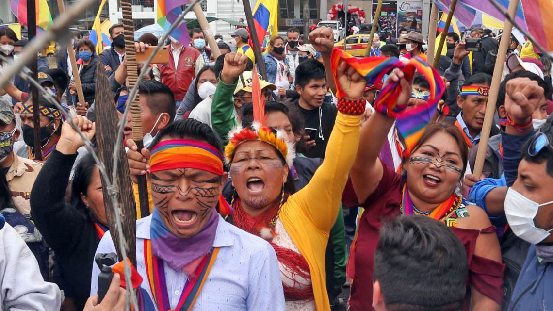 Supporters of Ecuadorean presidential candidate Yaku Pérez demonstrate outside the National Electoral Council (CNE) in Quito, on February 12, 2021.