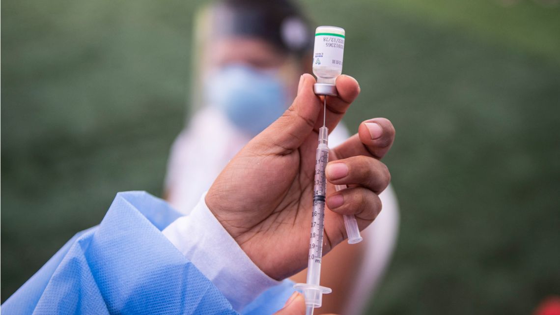 A nurse prepares a dose of the vaccine developed by Sinopharm of China against Covid-19 during a health workers vaccination campaign amid the novel coronavirus pandemic, in Ate, a district in Lima, on February 19, 2021.