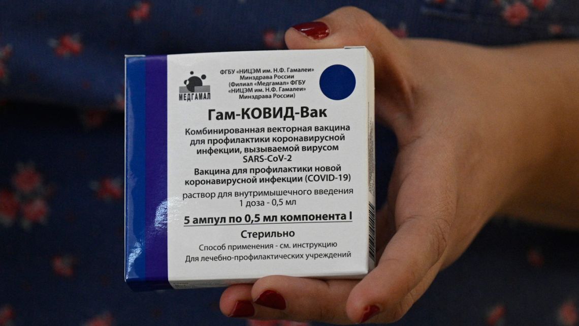 A health worker holds a box with five doses of the Sputnik V vaccine against Covid-19, before vaccination health and education workers in a school in Bernal on February 18, 2021. 