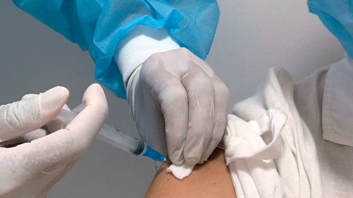 A teacher is inoculated with the CoronaVac vaccine, developed by China's Sinovac laboratory, against the novel coronavirus disease, COVID-19, in Montevideo on March 1, 2021. 