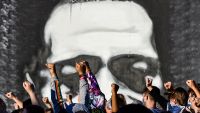 People raise their hands as they protest at the makeshift memorial in honour of George Floyd, on June 4, 2020 in Minneapolis, Minnesota.