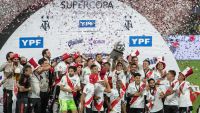 River Plate's players and coaching staff celebrate their win.