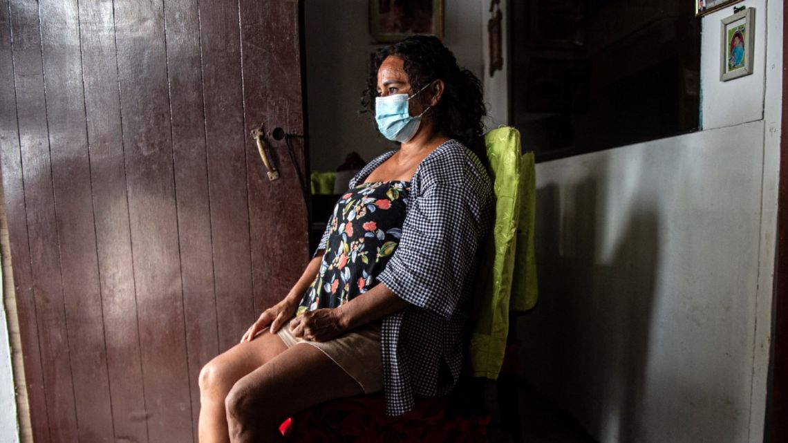 Nancy Sánchez, 48, poses for a picture at her home in Villa El Salvador, in the southern outskirts of Lima on March 03, 2021. Nancy was sterilised without her consent after the birth of her last daughter Nicole. 