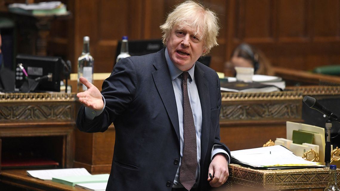 A handout photograph released by the UK Parliament shows Britain's Prime Minister Boris Johnson delivering a statement on the Government's 'Integrated Review' in a socially distanced, hybrid session at the House of Commons, in central London on March 16, 2021. 