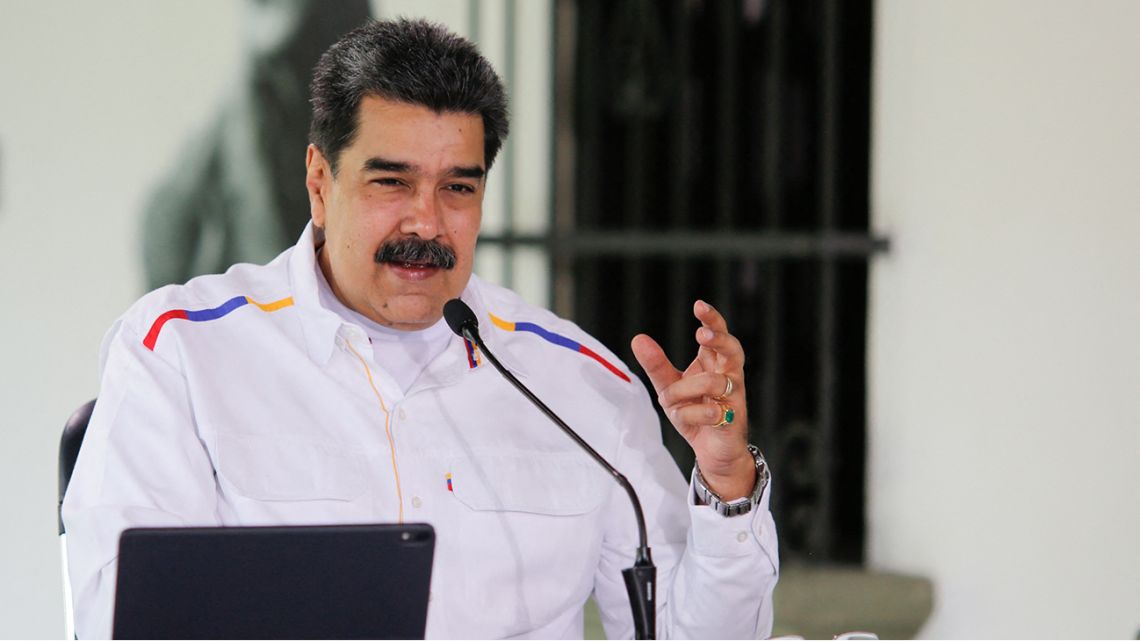 Handout photo released by the Venezuelan Presidency of Venezuela's President Nicolas Maduro speaking during a televised message at Miraflores Presidential Palace in Caracas on March 28, 2021.