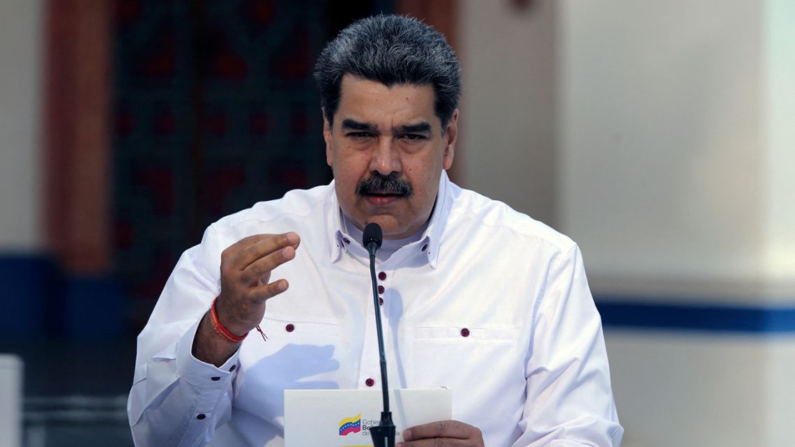 Handout picture released by the Venezuelan Presidency of Venezuela's President Nicolas Maduro speaking during a broadcast message at Miraflores Presidential Palace in Caracas on April 4, 2021.