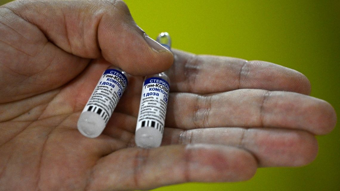 In this file photo taken on April 15, 2021, a health worker shows vials of the Russian Sputnik V vaccine against Covid-19, at a vaccination centre at the Tecnopolis park in Villa Martelli, Buenos Aires Province.