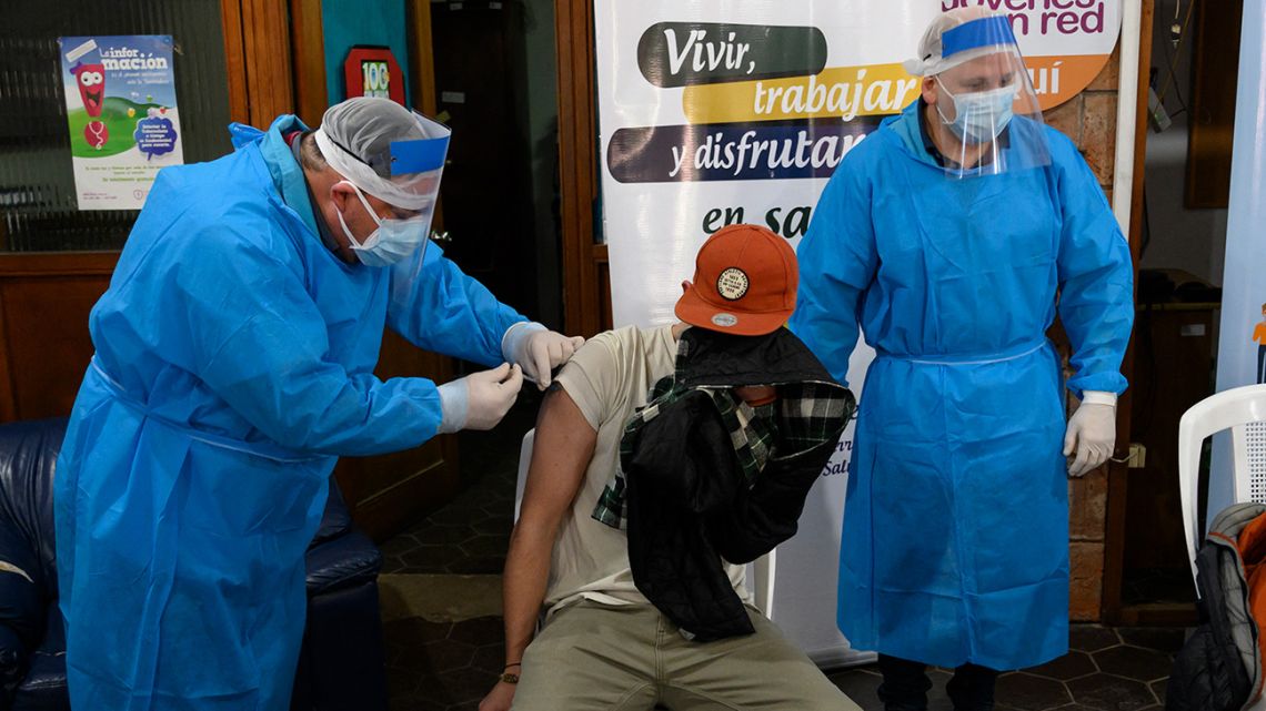 A man is inoculated with the first dose of the Pfizer-BioNTech Covid-19 vaccine in Paso de Carrasco, Canelones department, Uruguay on May 26, 2021. Uruguay surpassed 4,000 deaths from COVID-19 on Wednesday and remains as the country with the highest relative rate of deaths due to the virus in the last 14 days, according to AFP figures.