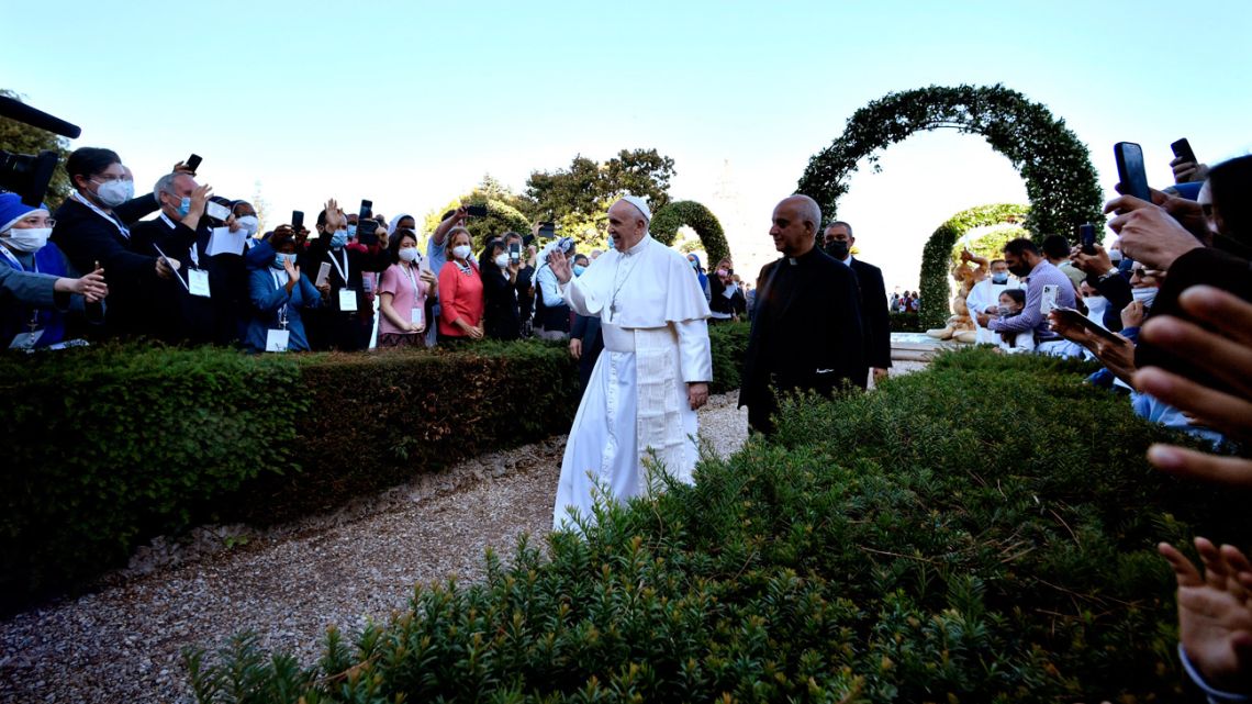 Pope Francis (centre) leaves after leading the last prayer of the global prayer marathon for the entire month of May, praying for an end to the coronavirus (Covid-19) pandemic, in the gardens of the Vatican on May 31, 2021.
