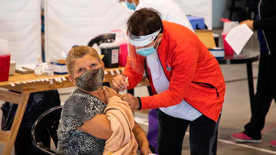A woman is given a shot against Covid-19 at a vaccination centre in Buenos Aires.