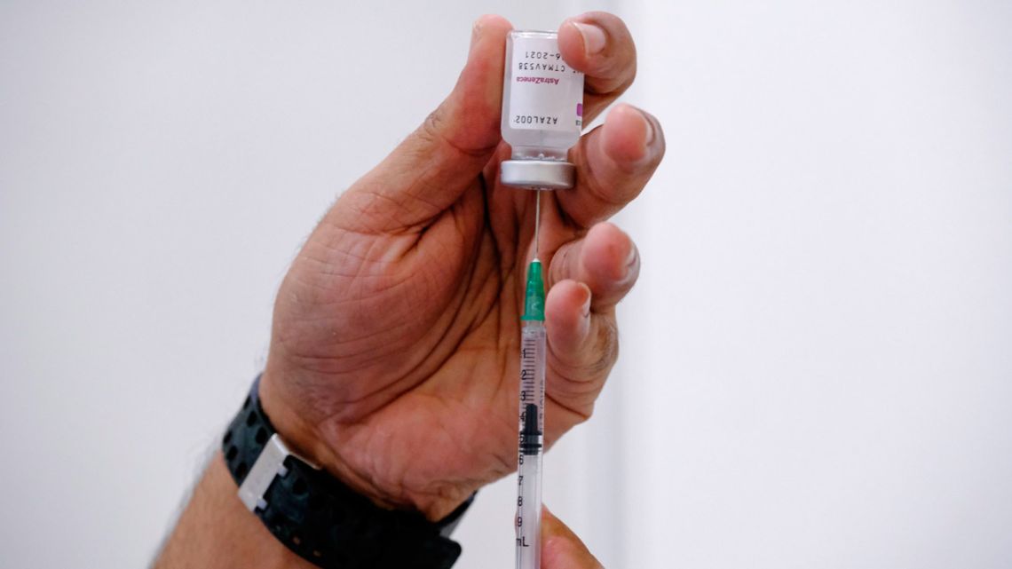A nurse prepares to administer a dose of AstraZeneca Covid-19 vaccine. 