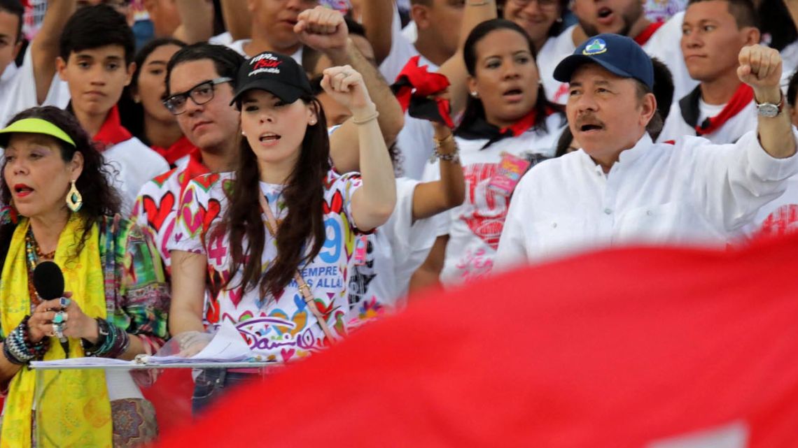 Nicaraguan President Daniel Ortega (right), his wife, Vice-President Rosario Murillo (left) and their daughter Camila Ortega (centre), attend an event commemorating the 40th anniversary of the Sandinista Revolution at “La Fe” square in Managua.