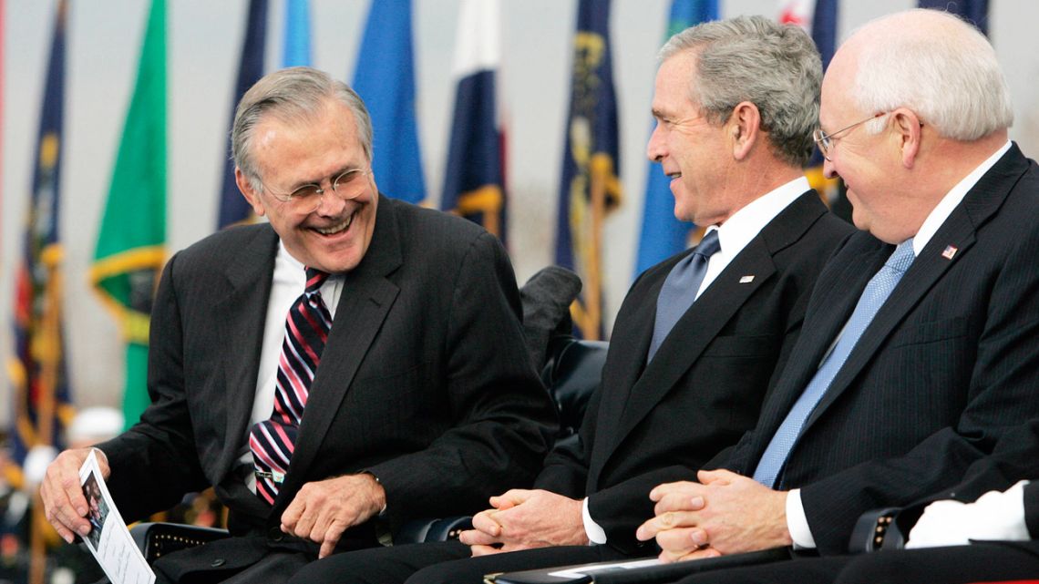 In this file photo taken on December 15, 2006, outgoing US decretary of defense Donald Rumsfeld (left) is joined by then-US president George W. Bush (centre) and then-US vice president Dick Cheney (right) during an Armed Forces Full Honor Review in Honor of the Secretary of Defense at the Pentagon in Washington, DC. 
