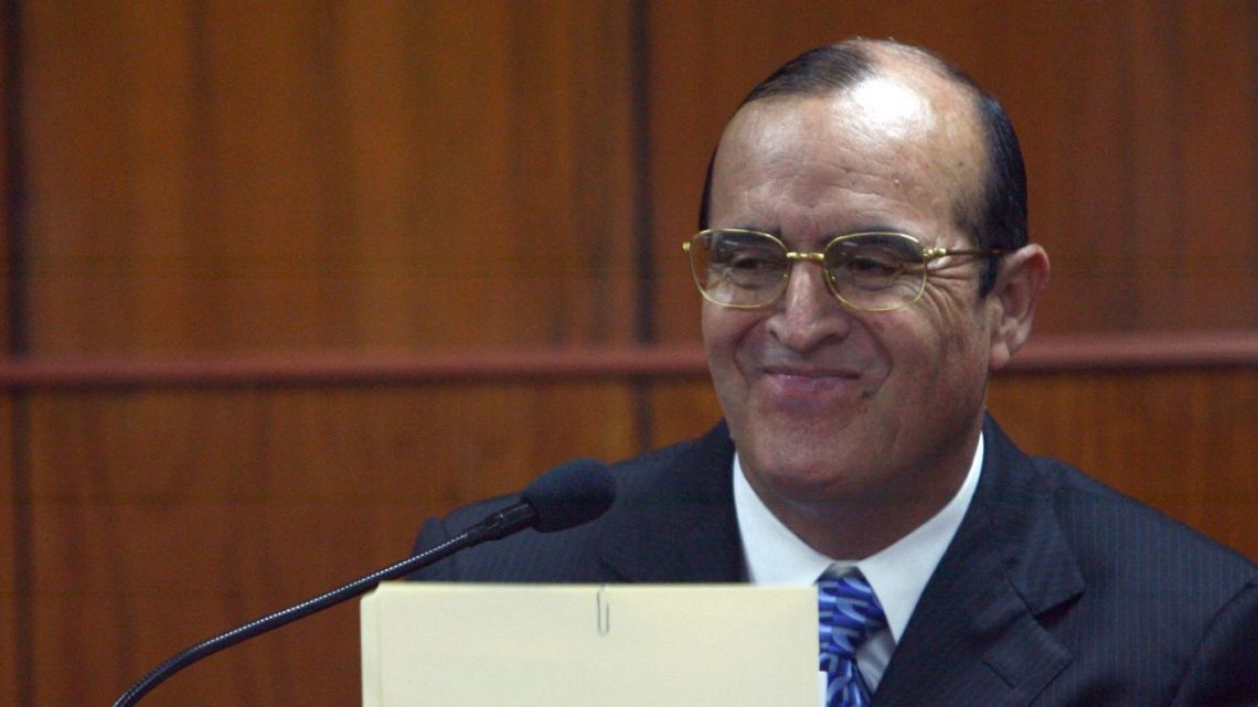 In this file photo taken on June 30, 2008, Vladimiro Montesinos smiles during a court hearing probing human rights violations, before the Special Court of the Peruvian Supreme Court in Lima.