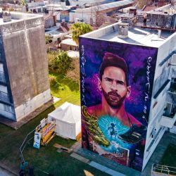 Images of a giant mural depicting Lionel Messi in Rosario, Santa Fe Province, Argentina. The mural, located in front of the school which Messi attended as a child, is the work of local artists Fer Lerena, Massi Ledesma, Lisandro Urteaga and Marlen Zuriaga.