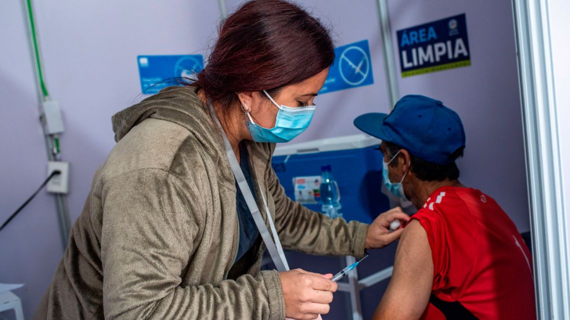 A healthcare worker administers a dose of the Sinovac Covid-19 vaccine in Santiago, Chile, on March 29.