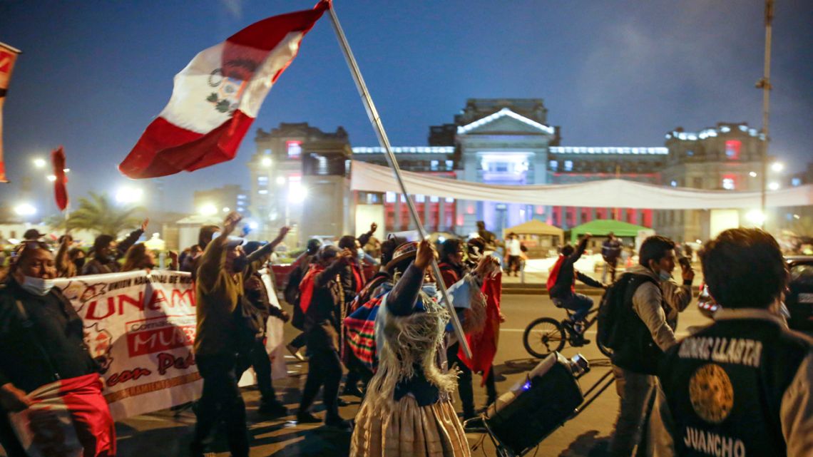 Supporters of Pedro Castillo celebrate in downtown Lima following the official proclamation of him as Peru’s president-elect on July 19, 2021.