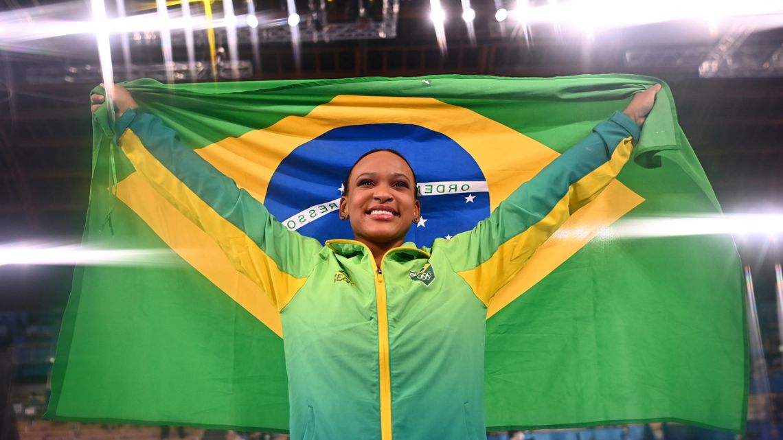 In this file photo taken on August 1, 2021, Brazil's Rebeca Andrade celebrates winning gold in the vault event of the artistic gymnastics women's vault final during the Tokyo 2020 Olympic Games at the Ariake Gymnastics Centre in Tokyo. 