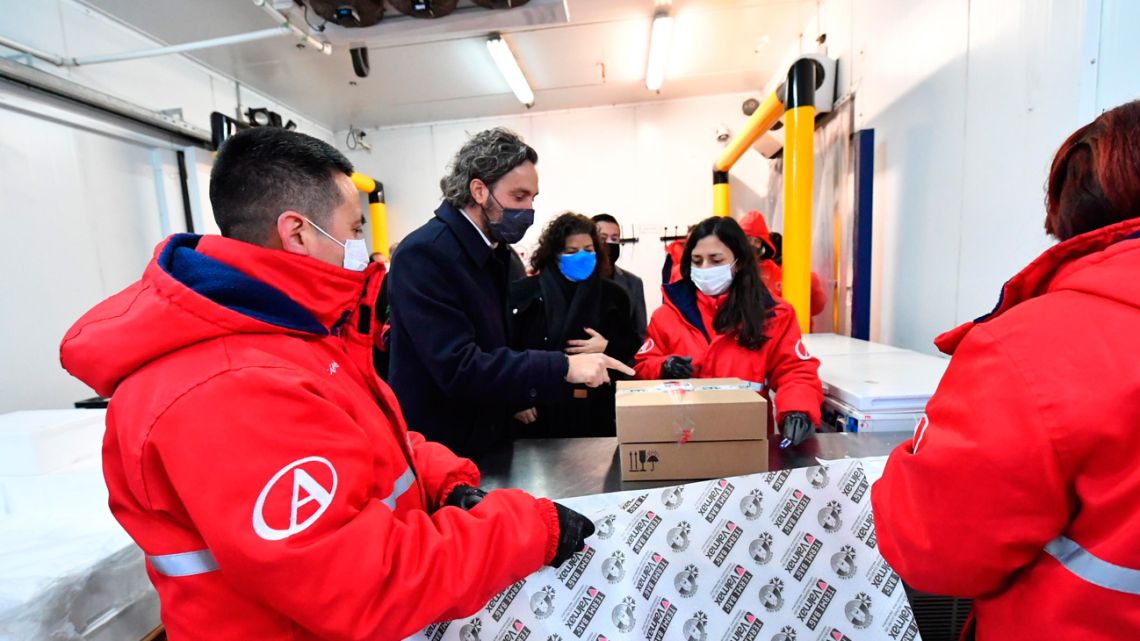 Cabinet Chief Santiago Cafiero and Health Minister Carla Vizzotti oversee the delivery of the first batch of local Sputnik V vaccines.