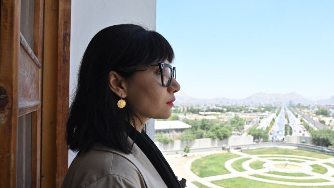 This file picture taken in Kabul on June 24, 2021, shows Afghanistan visual artist and photographer Rada Akbar pictured at the Darul Aman palace in Kabul. 