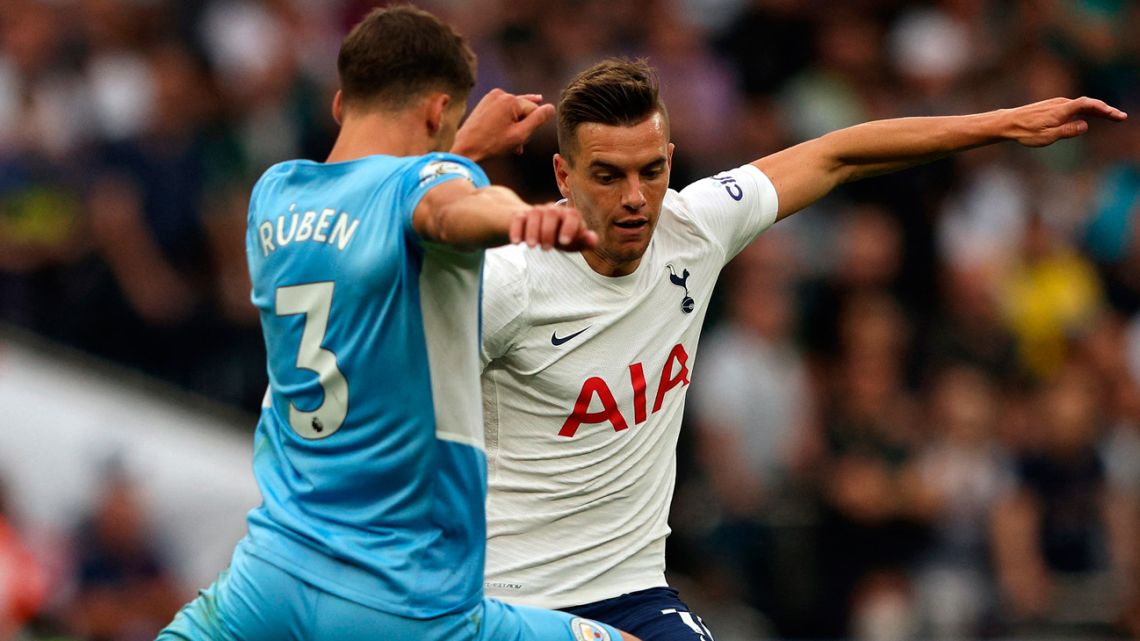 Manchester City's Portuguese defender Ruben Dias (left) vies with Tottenham Hotspur's Argentine midfielder Giovani Lo Celso during the English Premier League football match between Tottenham Hotspur and Manchester City at Tottenham Hotspur Stadium in London, on August 15, 2021. Tottenham won the match 1-0. 