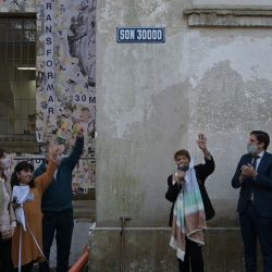 Taty Almeida, member of Madres de Plaza de Mayo-Linea Fundadora, unveils the new road sign at the former ESMA Navy Mechanics School (ESMA) which was used as a torture centre during the last military dictatorship in Argentina (1976-1983), next to Argentina's Education Minister Nicolás Trotta (second from right) and Human Rights Secretary Horacio Pietragalla Corti (left) in commemoration of the International Day of the Victims of Enforced Disappearance in Buenos Aires on August 30, 2021. 