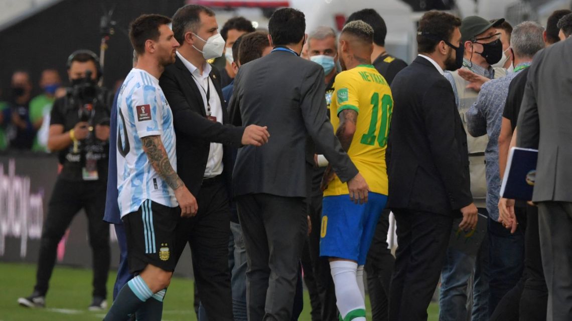 Argentina's Lionel Messi and Brazil's Neymar are seen after employees of the National Health Surveillance Agency (Anvisa) entered to the field during the South American qualification football match for the FIFA World Cup Qatar 2022 between Brazil and Argentina at the Neo Quimica Arena, also known as Corinthians Arena, in São Paulo, Brazil, on September 5, 2021. 