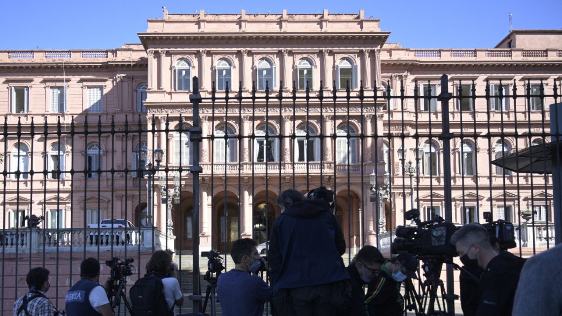 Cameramen and photojournalists stand guard outside the Casa Rosada government palace in Buenos Aires on September 16, 2021. 