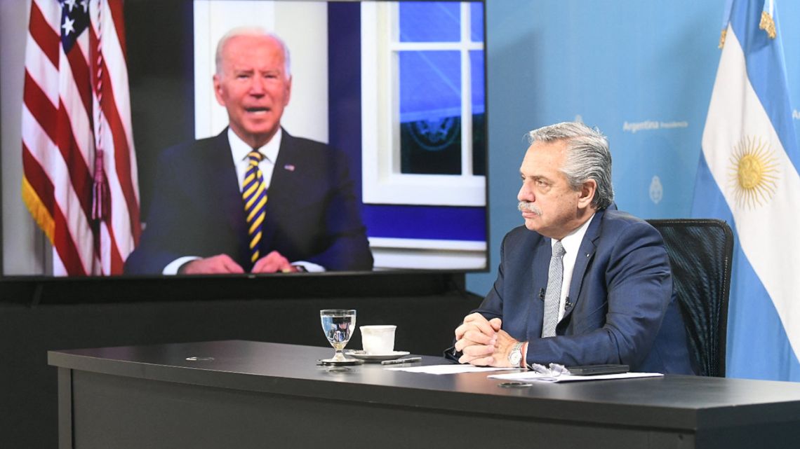 Handout picture released by the Presidency shows President Alberto Fernández (right) participating in a virtual meeting with US President Joe Biden during the Major Economies Forum on Energy and Climate to galvanise efforts to confront the global climate crisis, in Buenos Aires, on September 17, 2021. 