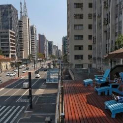 A man works at the terrace of a coworking space over Paulista Avenue, in São Paulo, Brazil, on September 27, 2021