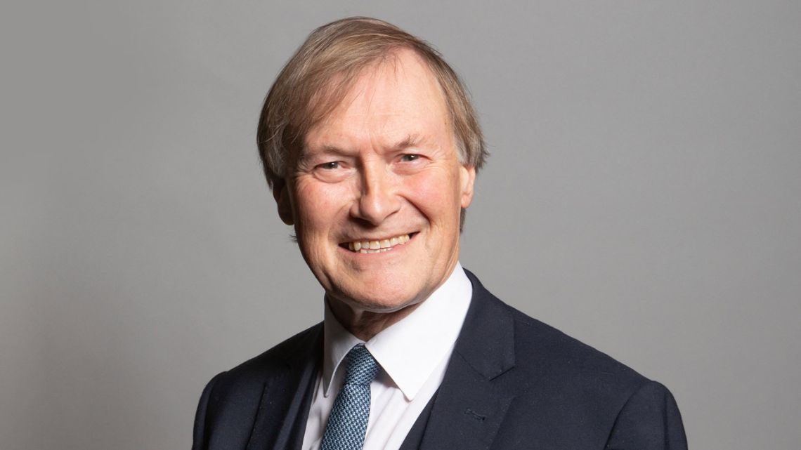 An undated handout photograph released by the UK Parliament shows Conservative MP for Southend West, David Amess, posing for an official portrait photograph at the Houses of Parliament in London. 