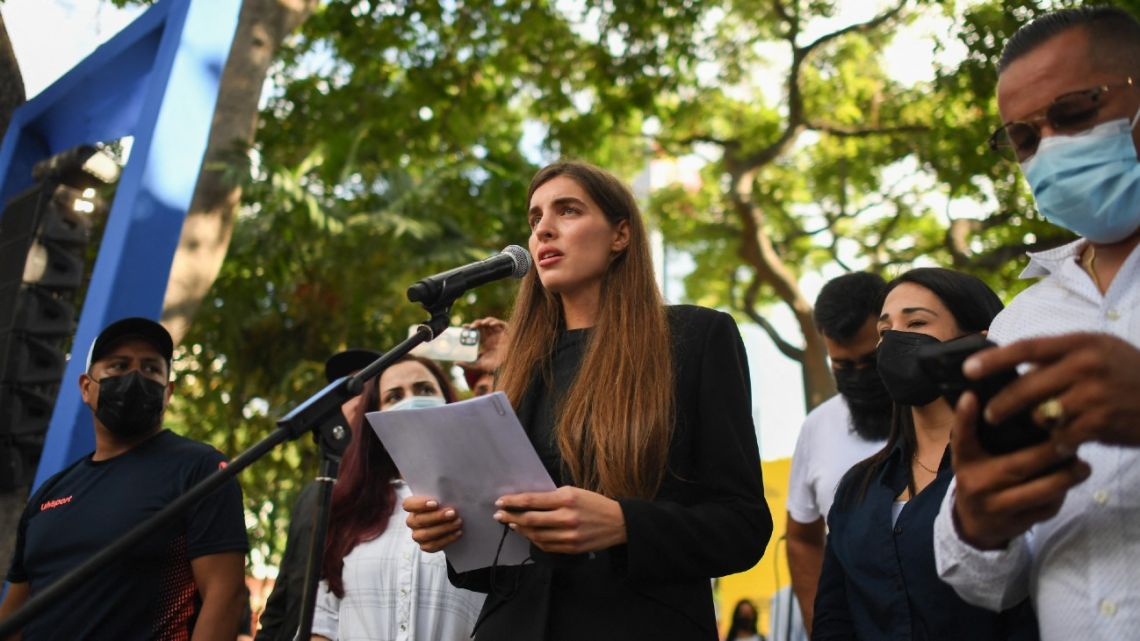 Camilla Fabri, the wife of Colombian businessman Alex Saab, who was estradited to the US, speaks during a demonstration demanding his release, at the Bolivar square in Caracas, on October 17, 2021. Venezuela's opposition called on President Nicolas Maduro's government to resume talks to resolve their differences, after the ruling party withdrew from the latest round that was to begin Sunday in Mexico. 
