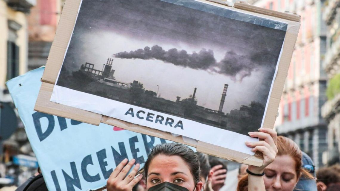 A protestor calls for the closure of polluting power plants as G20 climate and energy ministers met in Naples in July
