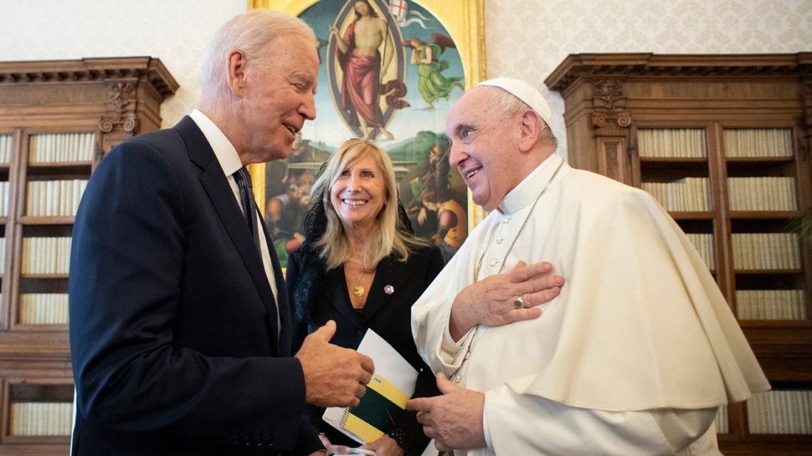 This photo taken and handout by the Vatican Media on October 29, 2021 shows Pope Francis meeting with US President Joe Biden during a private audience at The Vatican, ahead of an upcoming G20 summit of world leaders to discuss climate change, Covid-19 and the post-pandemic global recovery. 