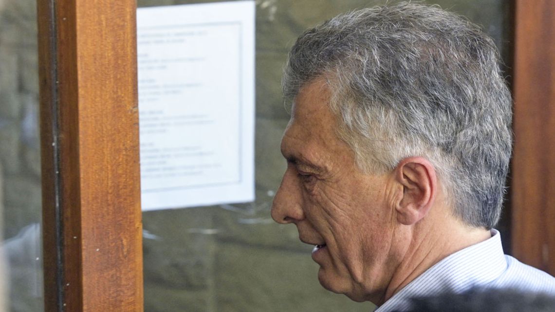 Former president Mauricio Macri arrives to Dolores' town hall prior to appear before hearing before a judge of the federal court of Dolores, Buenos Aires province, on October 28, 2021.