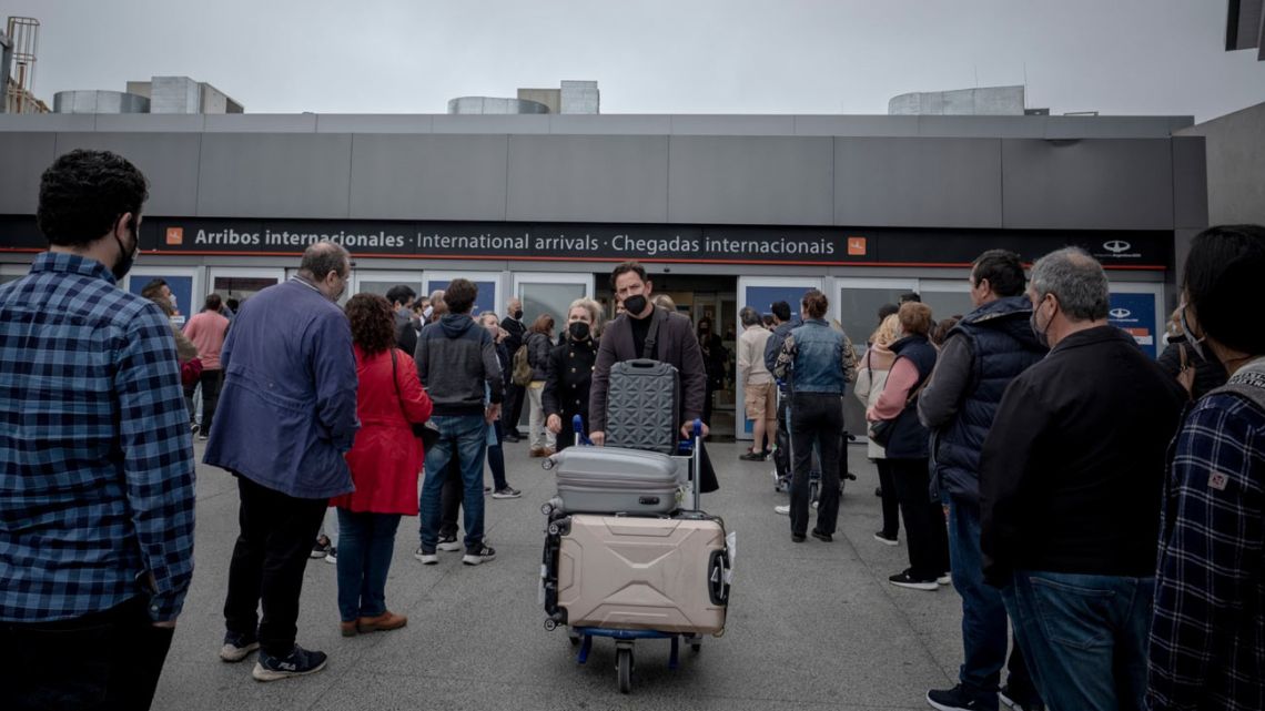Travellers arrive at Ezeiza International Airport (EZE) as quarantine restrictions are lifted in Buenos Aires, Argentina, on Monday, November 1, 2021. 