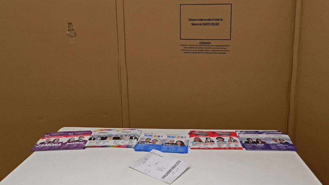 Ballot papers of different parties are seen at a polling station during midterm congressional elections in Buenos Aires, on November 14, 2021. 