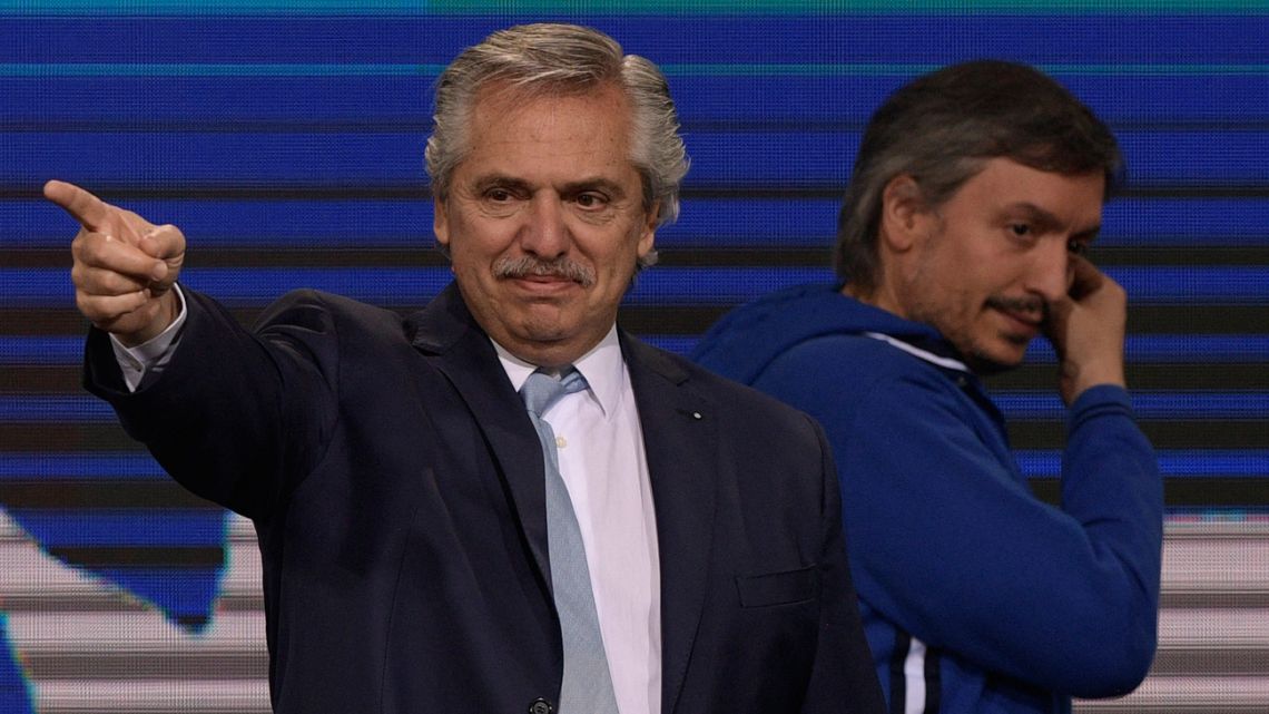 President Alberto Fernández, pictured onstage next to legislator Máximo Kirchner, son of Vice-President Cristina Fernández de Kirchner, at the Frente de Todos bunker  in Buenos Aires after the midterm elections, on November 14, 2021. 