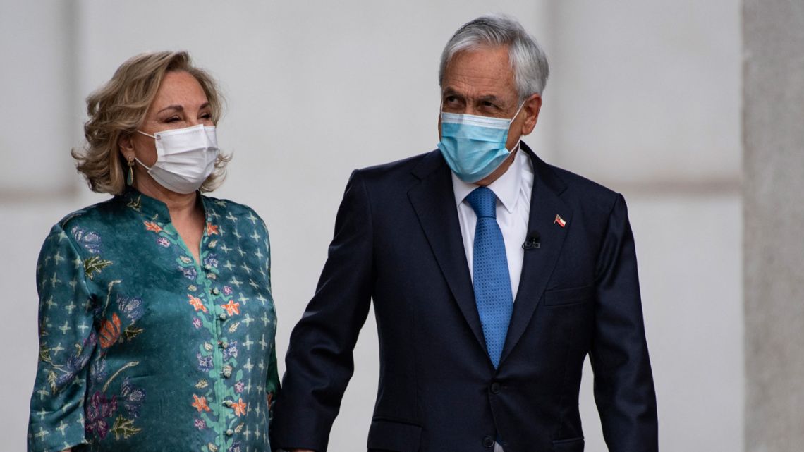 Chilean President Sebastián Piñera and his wife Cecilia Morel arrive for a press conference at La Moneda presidential palace in Santiago, on November 10, 2021. 