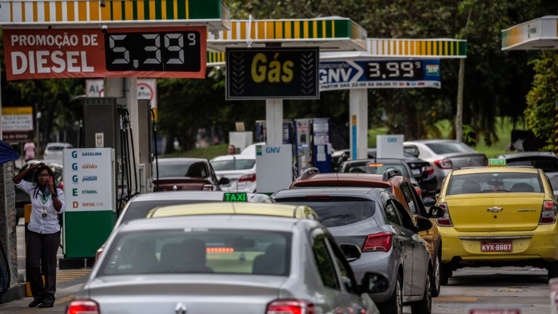 Vehicles wait in line at a Petrobras gas station in Rio de Janeiro, Brazil, on Thursday, October 21, 2021. 