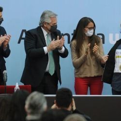 Valentine Luy Machado (right) receives one of Argentina's first non-binary DNIs at a ceremony attended by Interior Minister Eduardo ‘Wado’ De Pedro (left), President Alberto Fernández (second from left) and Women, Gender and Diversity Minister Elizabeth Alcorta (third from left).