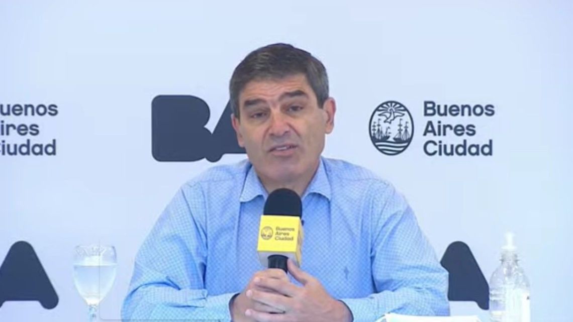 Buenos Aires City Health Minister Fernán Quiros (centre) leads a press conference.
