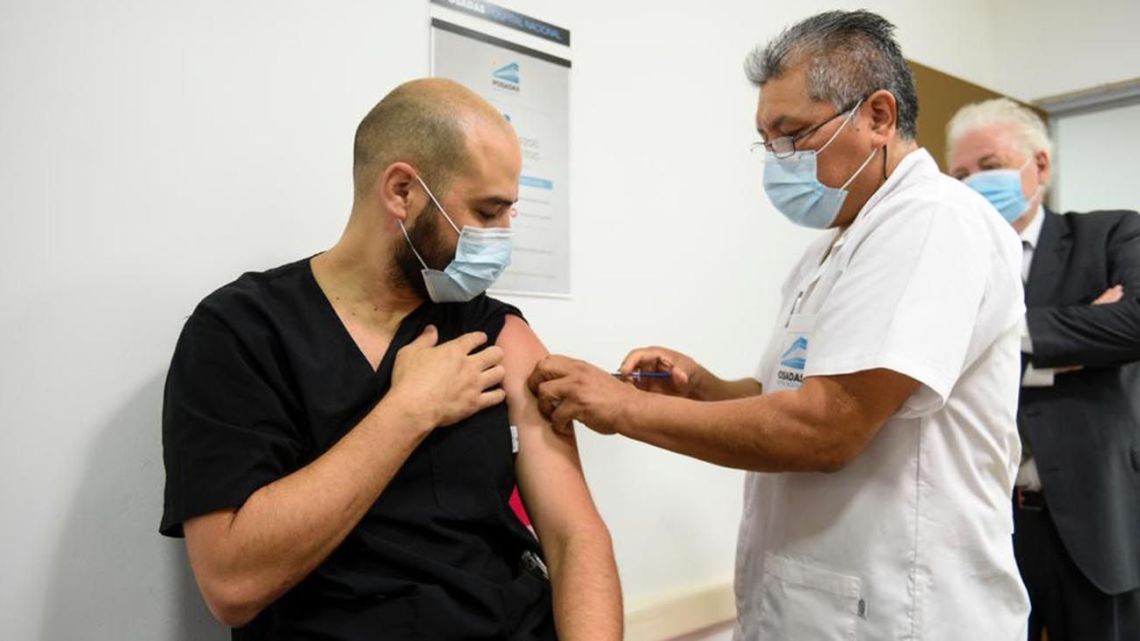 Francisco Traverso, an intensive care physician at the Hospital Nacional Posadas in El Palomar, receives a shot of Sputnik V vaccine against Covid-19 on Wednesday, December 24, 2020.