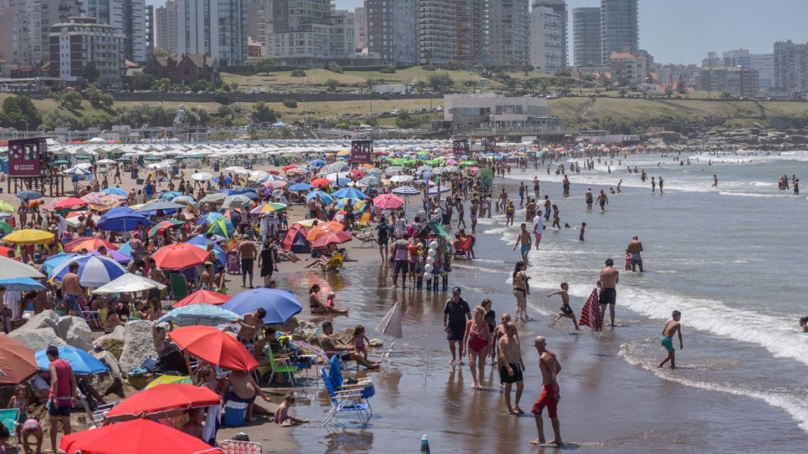 People are seen at Playa Grande in Mar del Plata, Argentina, on January 11, 2022. 