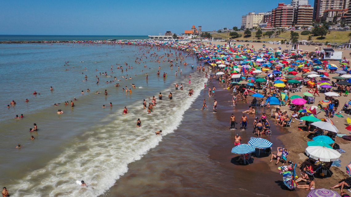 Aerial view of people at the Torreon del Monje beach in Mar del Plata on January 11, 2022.