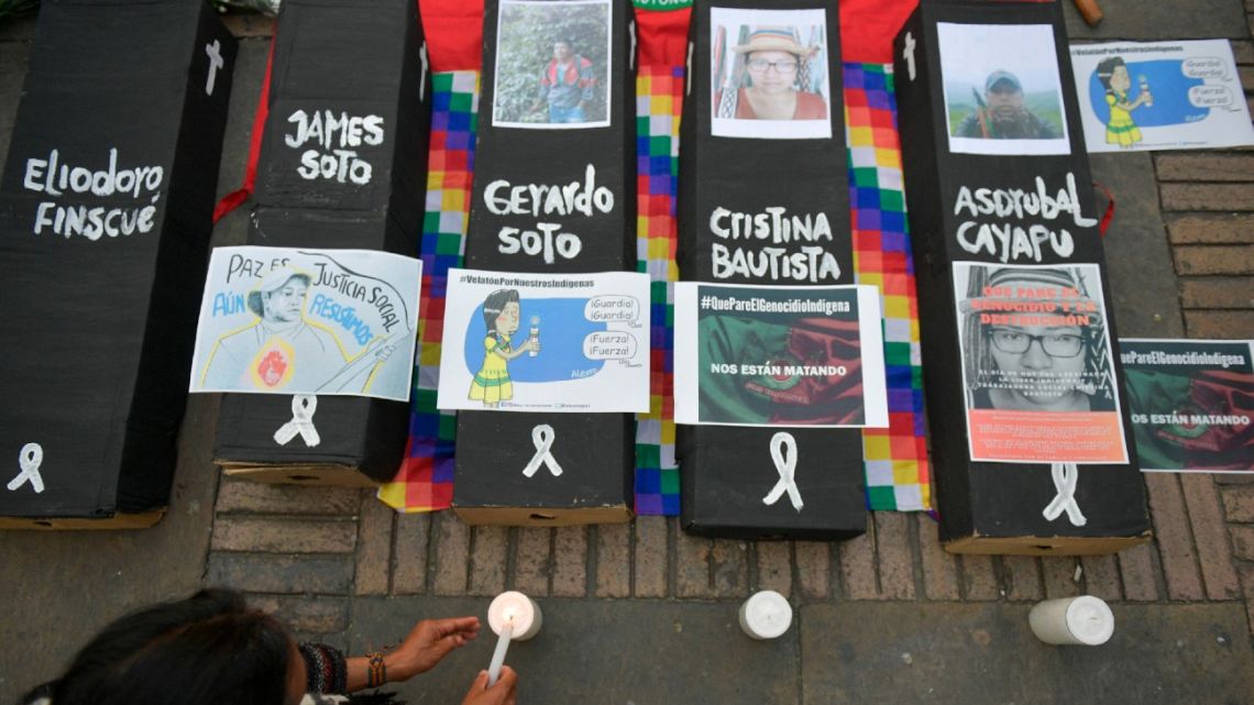 In this file photo taken on October 30, 2019, members of the National Indigenous Organisation of Colombia (ONIC), activists and politicians attend a symbolic ceremony at Bolívar square in Bogotá following the recent murder of an indigenous leader and four guards. 